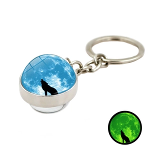 Porte-clés lumineux avec boule de verre, silhouette de loup et effet brillant dans le noir