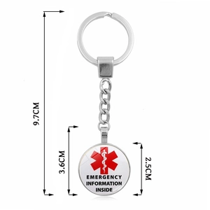 Silver medical alert keychain with red Star of Life symbol and emergency info pendant