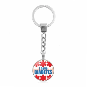Macro detail of silver keychain with medical alert charm showing I have DIABETES text