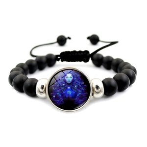 Detail of beaded Virgo constellation bracelet with black matte beads and silver accents