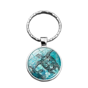 Porte-clés tortue marine argenté avec motif artistique de carapace turquoise