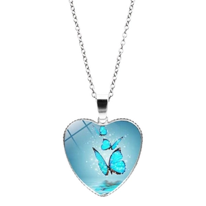 Blue butterfly heart-shaped pendant necklace with silver chain on white background