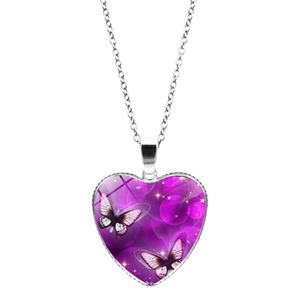 Detailed macro shot of the heart-shaped purple butterfly glass pendant and silver chain