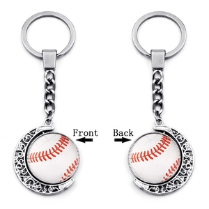 Detail view of double-sided rotatable baseball moon keychain with metallic finish