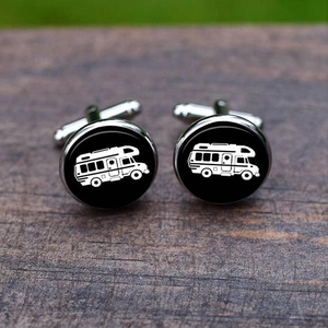 Silver cufflinks with black round inserts featuring a white RV camper van graphic design