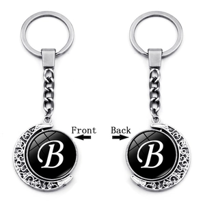 Rotating double-sided crescent moon keychain with letter B and silver alloy finish