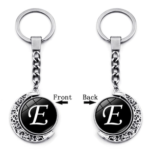 Detailed front and back view of silver moon pendant keychain with letter E design