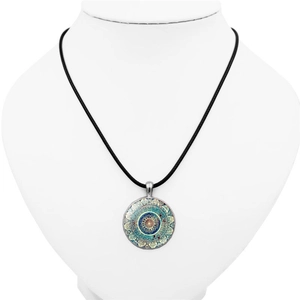 Mandala Flower of Life crystal glass pendant necklace with black cord on white bust