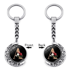 Rotating moon letter A keychain with vintage silver frame and floral double-sided design