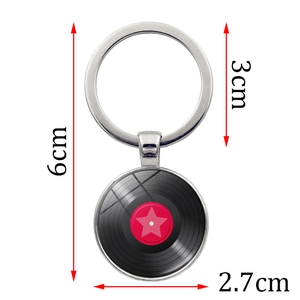 Vinyl record metal keychain with red star design, measuring 6cm in total length
