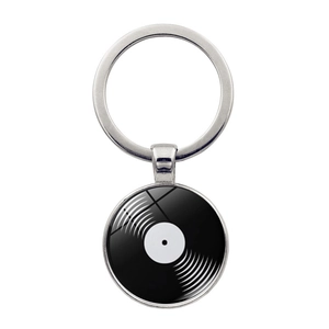 Close-up of a vintage vinyl record charm keychain with a polished silver metal ring