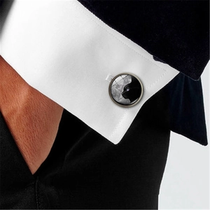 Elegant men's black cat silhouette glass gem cufflinks on white shirt and dark suit sleeve