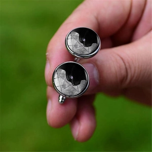 Silver mens cufflinks featuring a black cat under a purple moon and star pattern