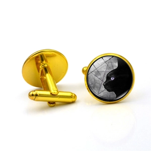 Golden round cufflinks for men featuring a black cat silhouette with mystical geometric art