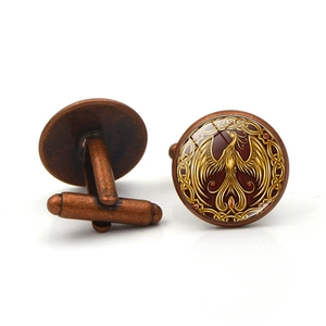Golden phoenix pattern cufflinks in bronze finish with round glass cabochon