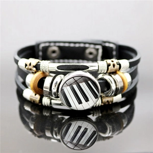 Bracelet multicouche en cuir noir avec dôme en verre de touches de piano et perles en métal