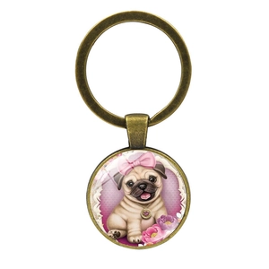 Detail of cute pug cartoon charm keychain with glass dome and bronze metal ring