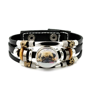 Multilayer leather bracelet with cute pug photo charm and punk style beads on white background