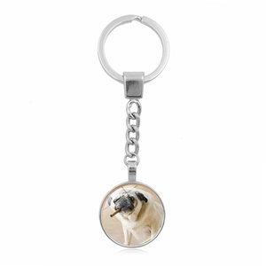 Pug dog glass cabochon pendant keychain with silver metal ring on white background