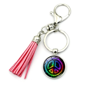 Rainbow peace sign keychain featuring pink faux leather tassel and silver lobster clasp