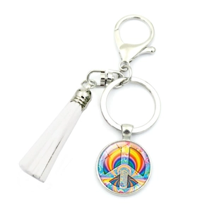 Detail of silver lobster clasp with white tassel and rainbow peace sign glass pendant