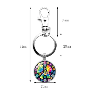 Rainbow peace sign flower keychain with hippie style tie-dye pendant and metal clasp