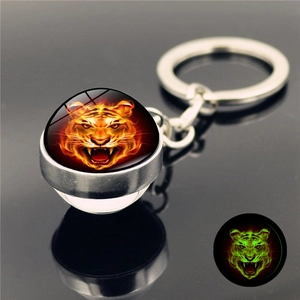 Luminous tiger head crystal glass ball keychain with orange fire pattern and silver metal ring