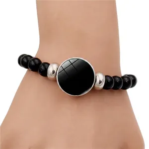 Customizable black beaded bracelet with silver spacers and personalized glass pendant