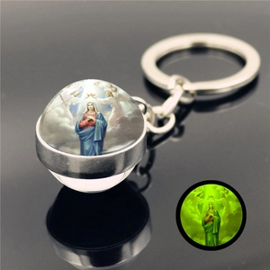 Detailed macro view of crystal glass keychain featuring Luminous Virgin Mary pendant