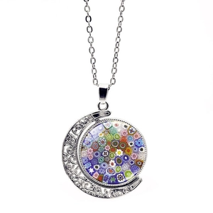 Detail view of silver moon pendant necklace with colorful Millefiori glass ball insert