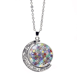 Detail of crescent moon pendant with colorful Venetian glass mosaic and silver chain