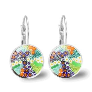 Close-up of Millefiori glass drop earrings with colorful floral patterns and silver hooks