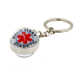 Détail du porte-clés d'alerte médicale argenté avec logo Star of Life et texte