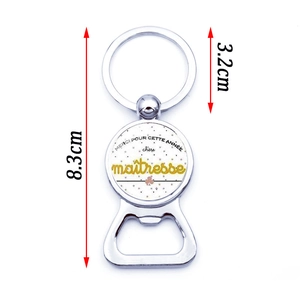 Silver metal keychain bottle opener with Merci Maîtresse French teacher gift design
