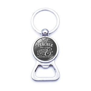Detail of metal bottle opener keychain with teacher appreciation quote and glass dome