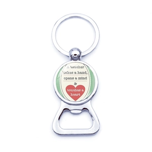 Detailed close-up of silver metal beer bottle opener keychain with teacher quote engraving