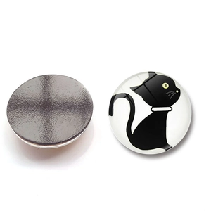 Macro view of front and back circular black cat fridge magnet with 30mm glass dome