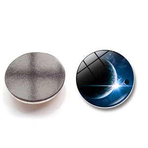 Macro shot of 3cm nebula glass fridge magnet showing the planetary design and magnetic back
