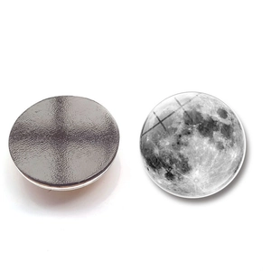 Close-up of the moon pattern crystal glass fridge magnet and its black magnetic back