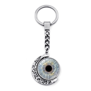 Evil eye moon keychain with a realistic blue iris pendant and vintage silver metal frame