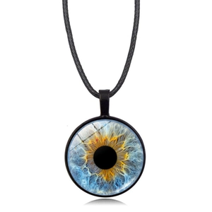 Close-up of glass dome pendant necklace with realistic blue and amber iris eye pattern