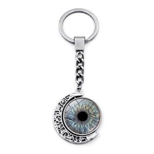 Vintage silver moon keychain featuring a rotating blue evil eye pendant on white background