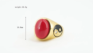Gold ring with oval red gemstone and Yin Yang detail, weighing 16.5g and 18.8mm high
