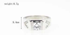 Macro detail of men's titanium steel wedding ring with center round diamond and side V-stones