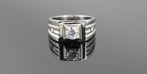 Detailed close-up of a men's titanium steel ring with a large square-set center zircon