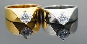 Macro shot of geometric faceted titanium steel rings with cubic zirconia settings