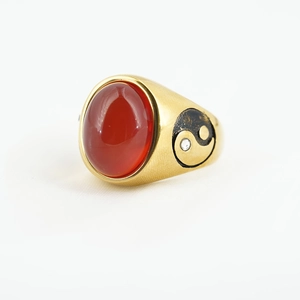 Vintage gold-plated ring featuring an oval red agate and Yin Yang side details