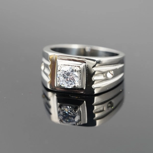 Men's wide stainless steel ring with a large round cubic zirconia stone centerpiece
