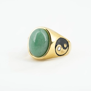 Vintage gold ring with oval green gemstone and yin yang symbol with small diamond
