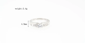 Detail view of a classic titanium wedding ring featuring square diamonds and 3.4g weight